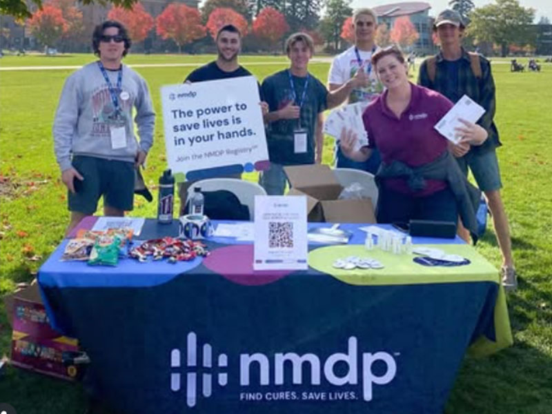 NMDP community event photo featuring members of SAE Fraternity